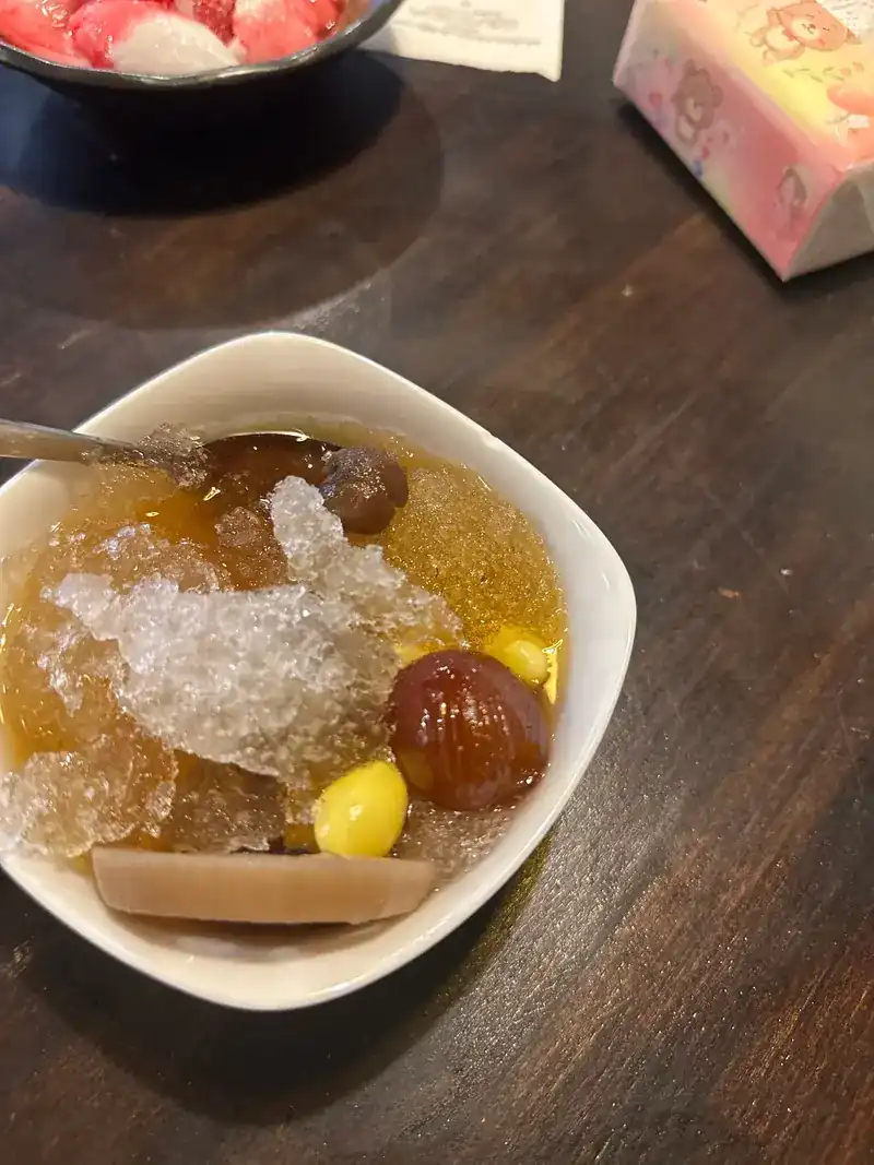 Clear syrup over crushed ice with lotus root and ginkgo nuts