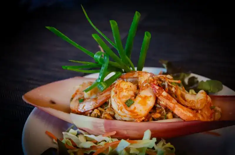 Prawns served in a banana blossom with spring onion