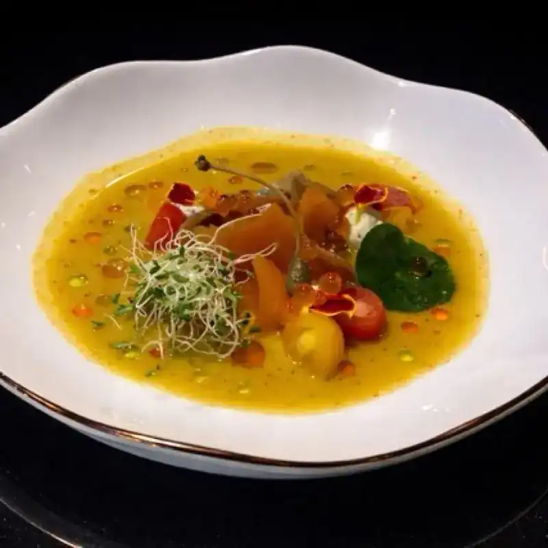 Salmon Crudo with citrus vinaigrette and herb oil
