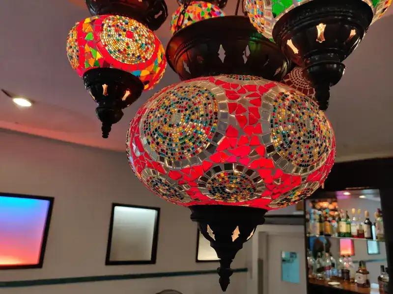 Coloured mosaic glass lamps hanging from the ceiling