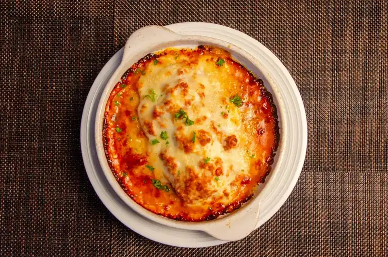 Lasagna baked in a round dish, seen from above