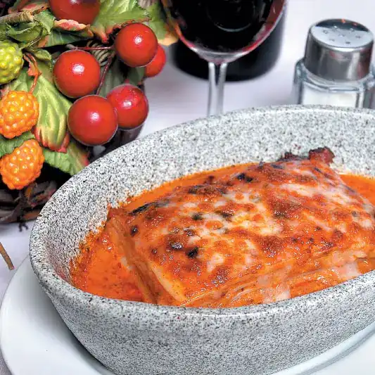 Baked lasagne in a granite dish