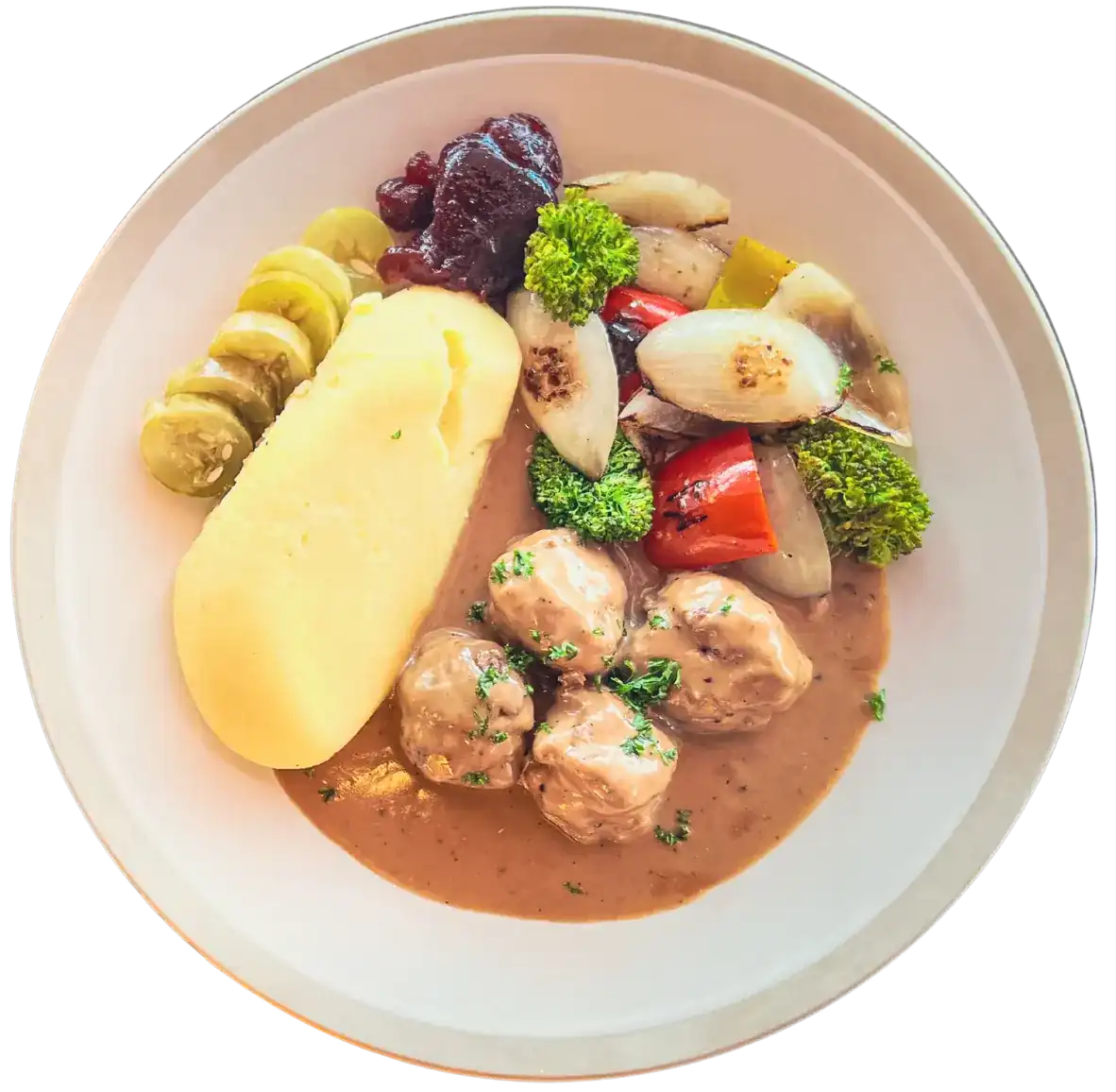 Swedish meatballs with mashed potatoes, pickled cucumber and lingonberry