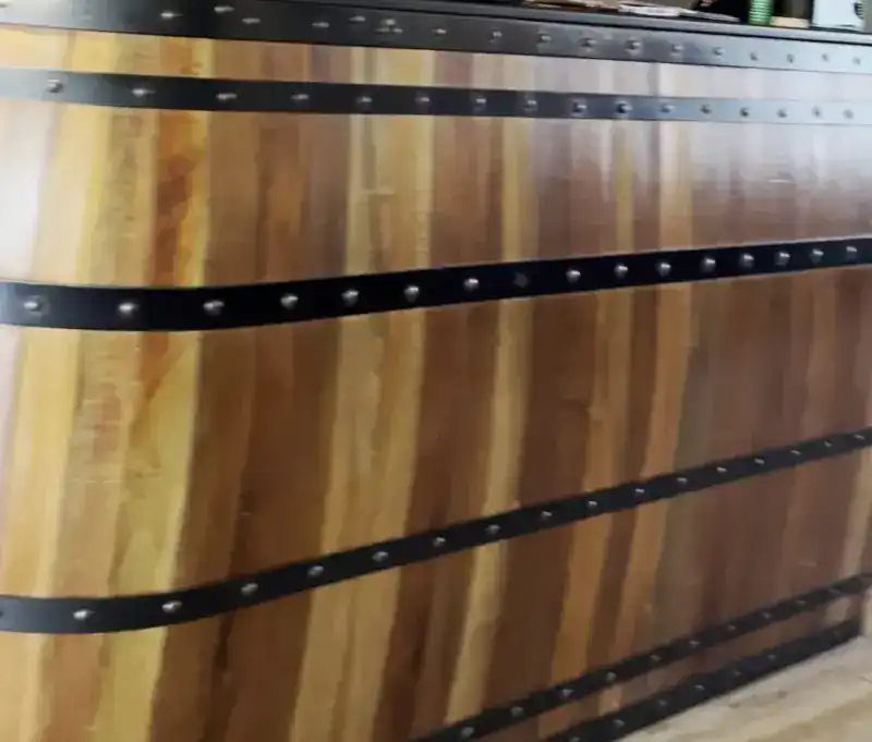 The bar front: wooden staves bound with riveted steel bands