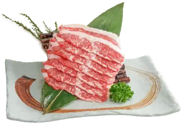 Thin slices of pork on a bamboo leaf