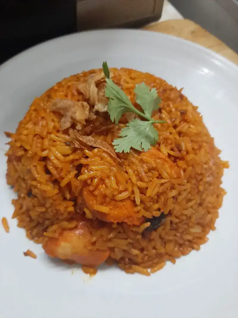 Spiced rice with prawns, fried onion and coriander
