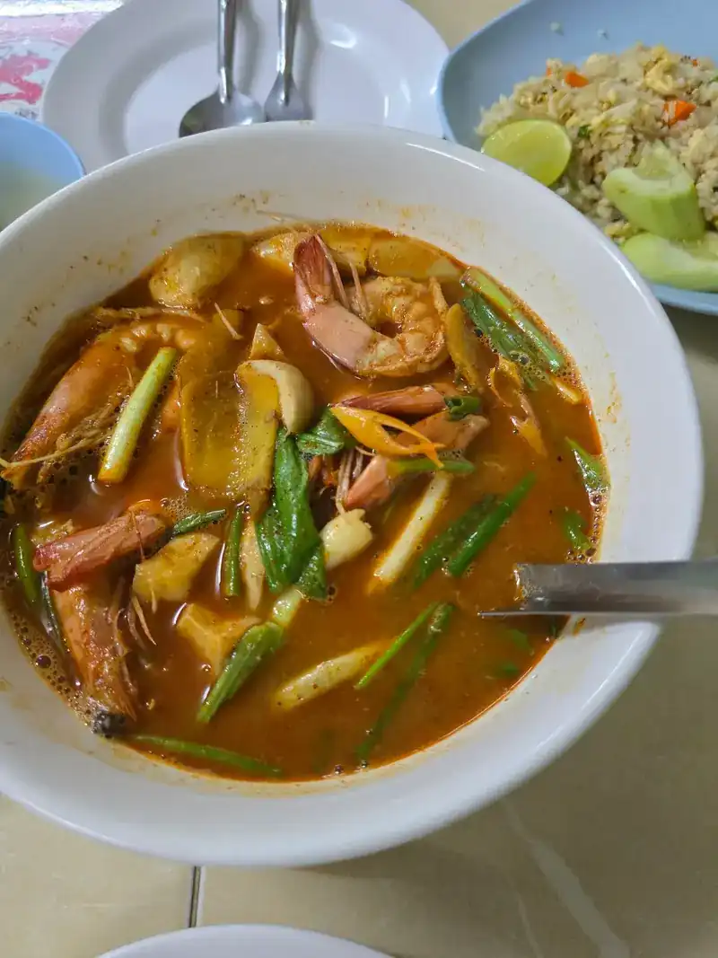 A bowl of tom yum with shrimp