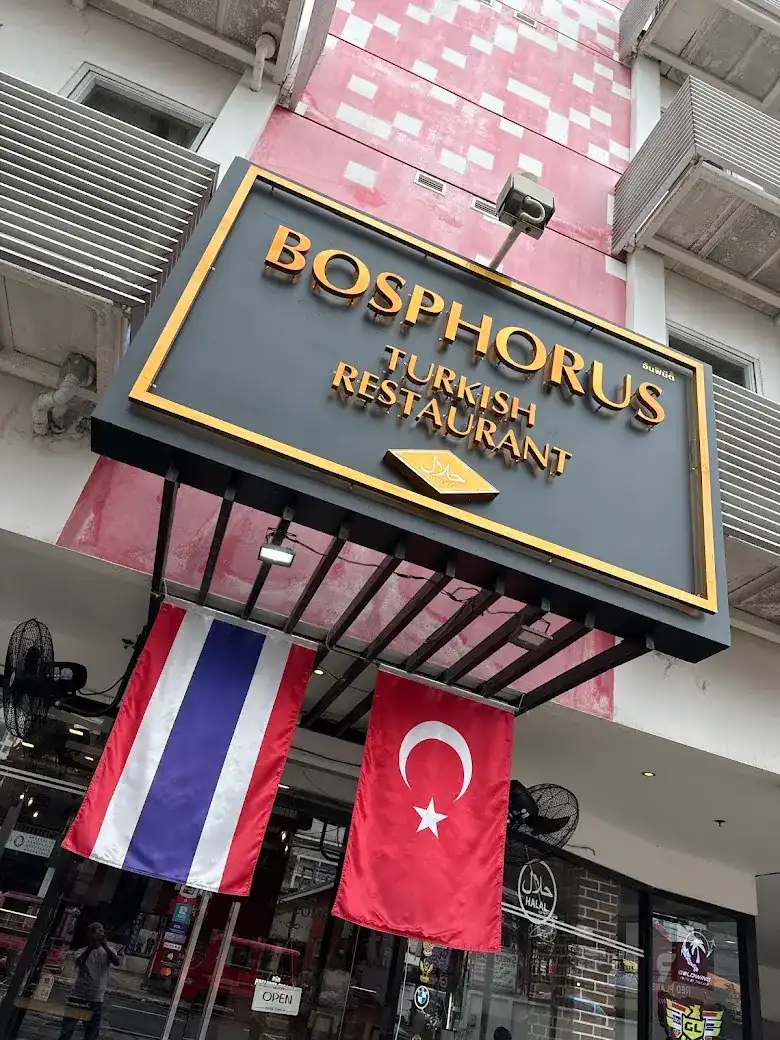 The Bosphorus sign by day, with the Thai and Turkish flags hanging below it