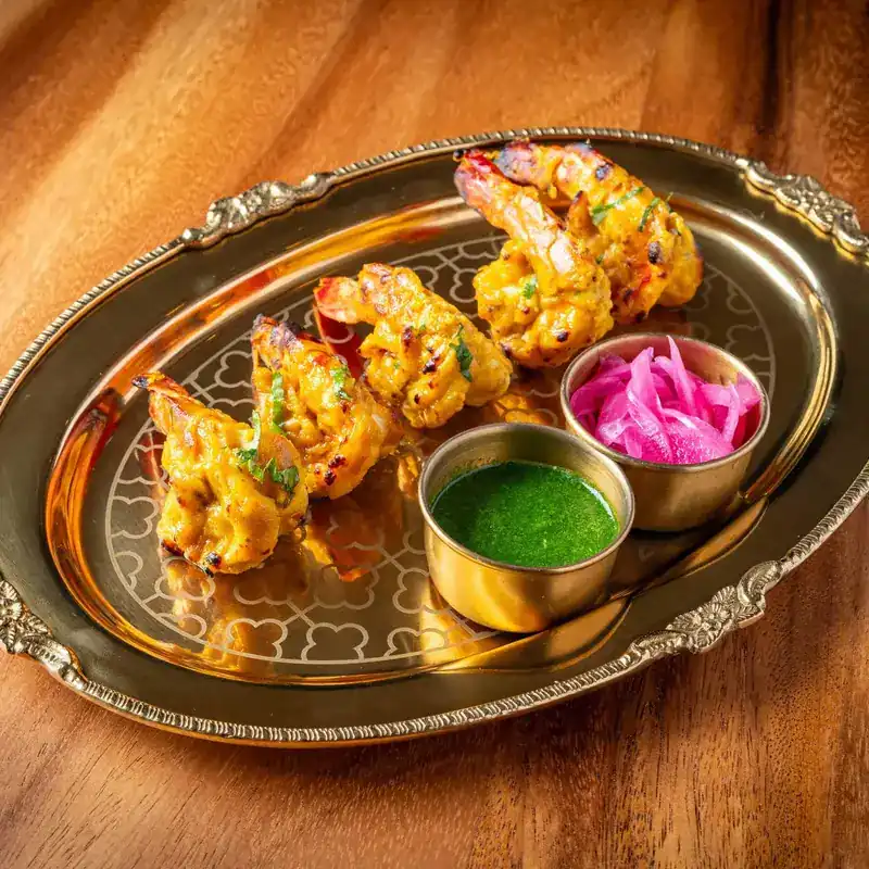 Tandoor prawns on a brass tray