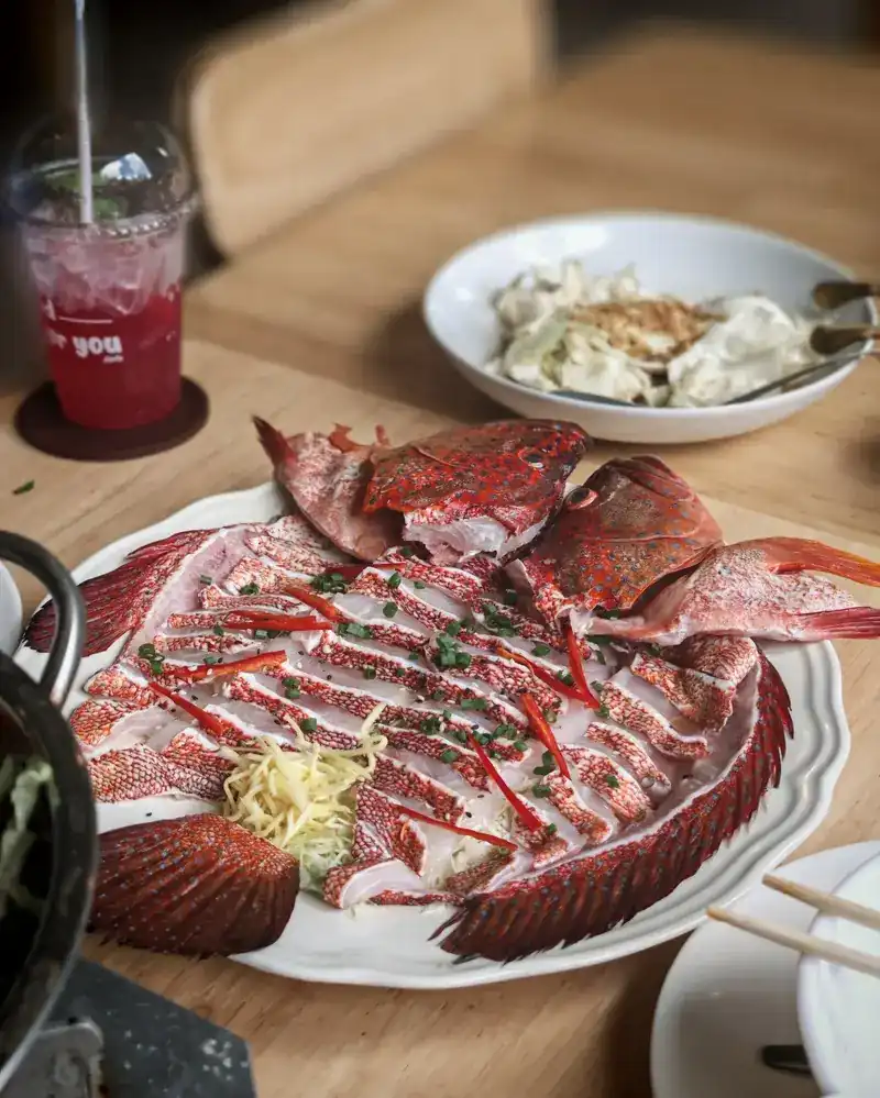 A whole red-skinned fish served as sashimi