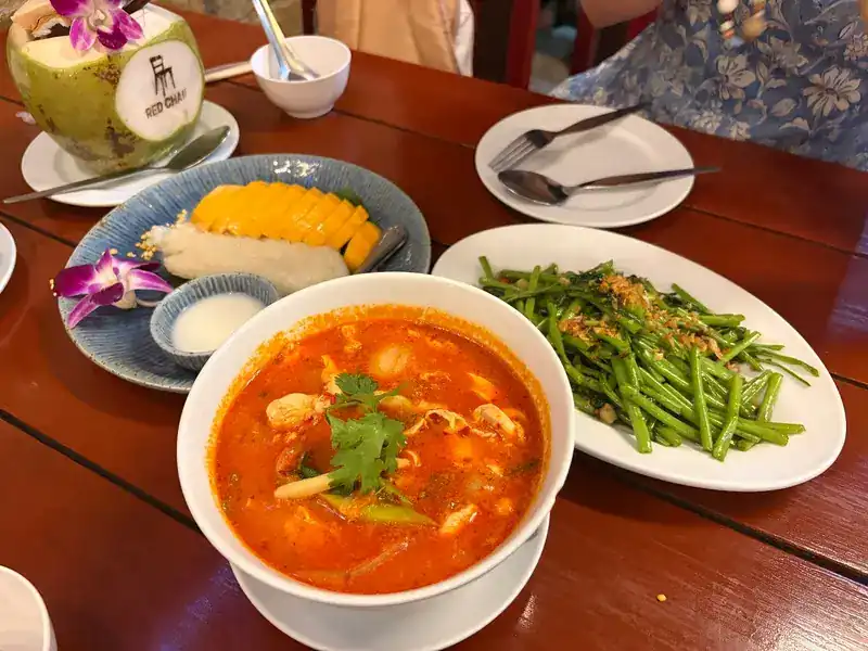 Tom yum, stir-fried morning glory and mango sticky rice, with a fresh coconut