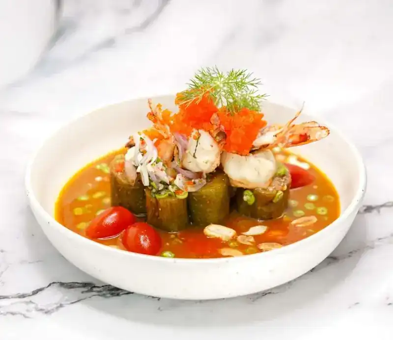 BBQ Thai long eggplant in a white bowl