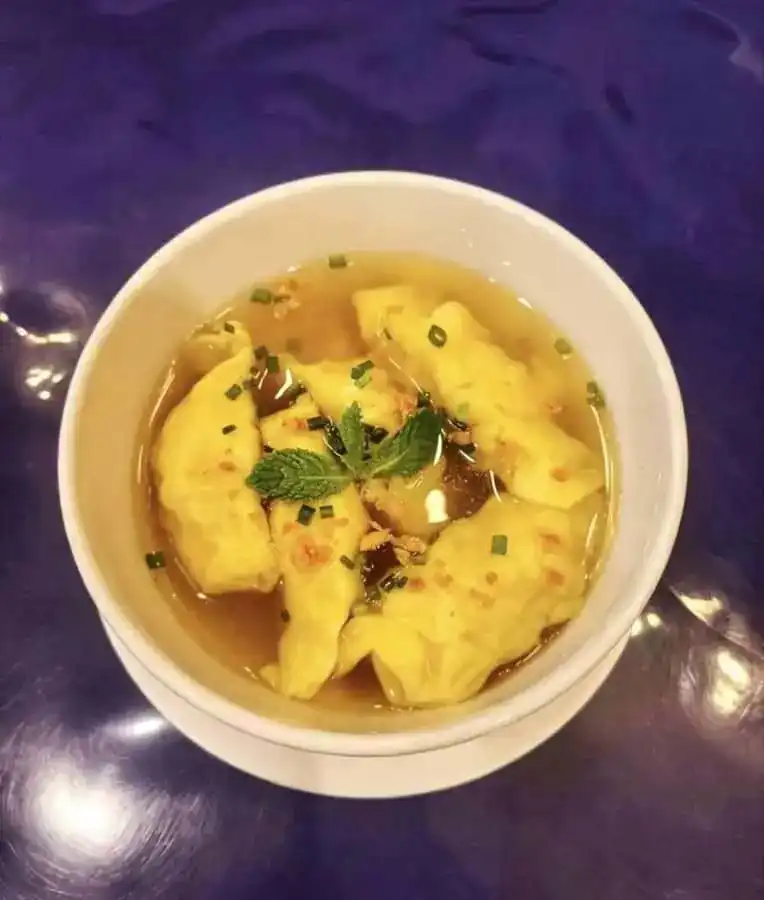 Shrimp wontons in clear broth with mint