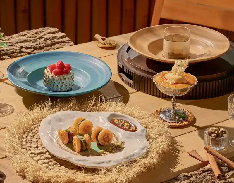 Desserts on a wooden table in the sun