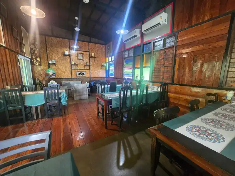 The wooden dining room with coloured glass windows
