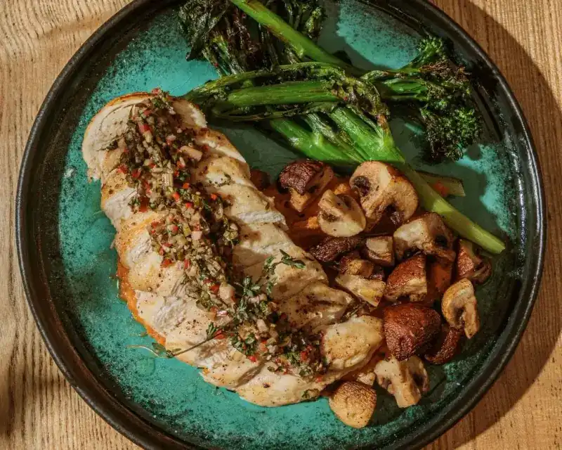 Grilled chicken with chimichurri, broccolini and mushrooms