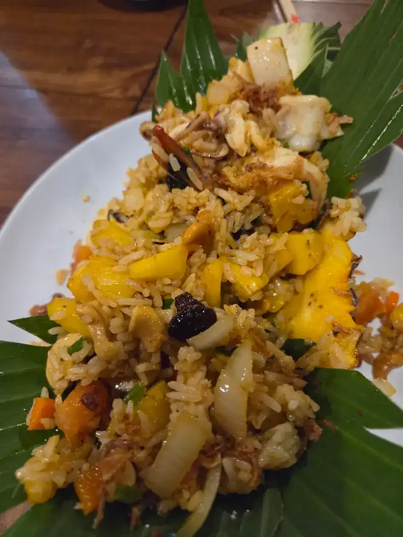 Pineapple fried rice served on cut leaves
