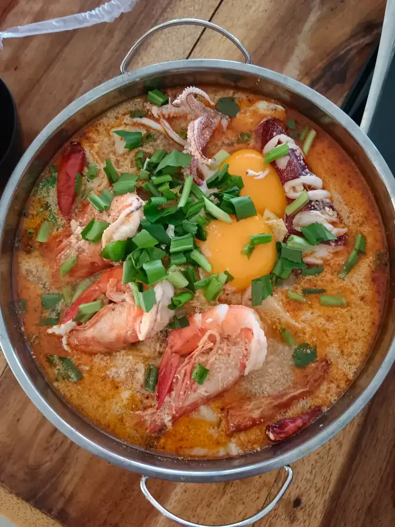 Creamy tom yum with prawns, squid and an egg