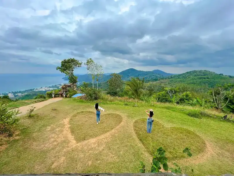 Two heart shapes cut into the lawn of the heart garden, hills behind