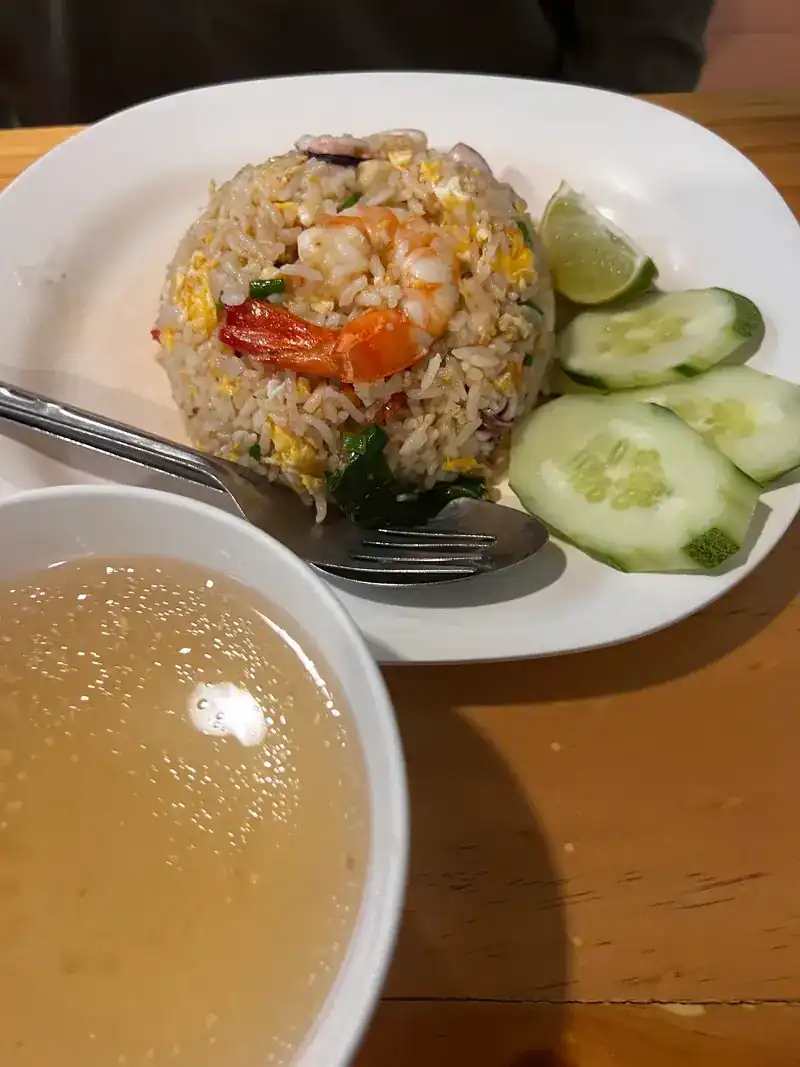 Fried rice with shrimp, cucumber and lime, with a bowl of soup