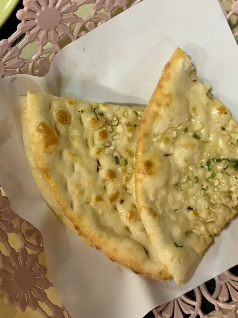 Naan bread with herbs, fresh from the oven