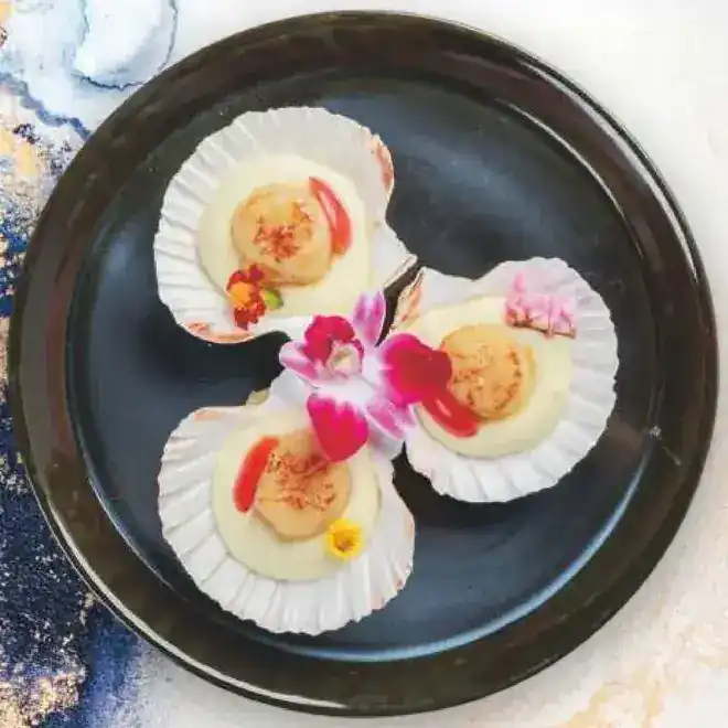 Three scallops in their shells