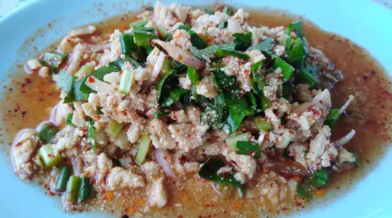 A minced salad with spring onion, herbs and chilli flakes