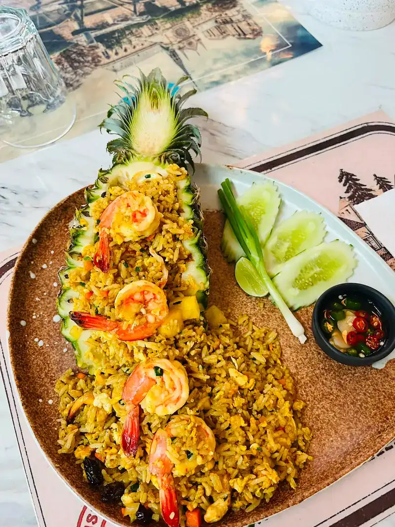Pineapple fried rice with prawns, served in a half pineapple
