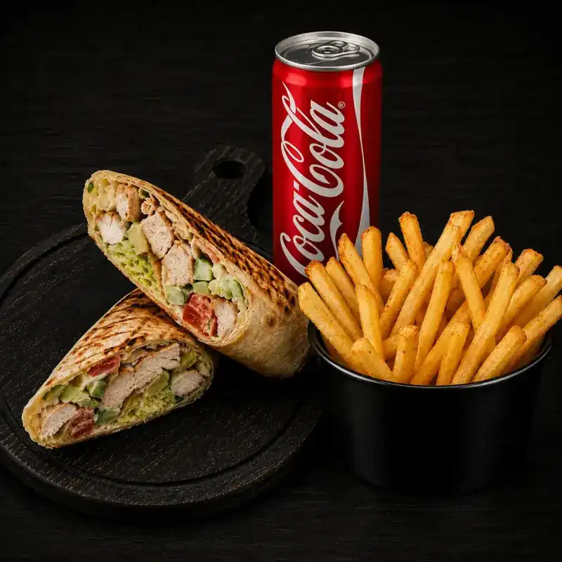 Lavash wrap cut in two on a dark board, grill marks across the bread