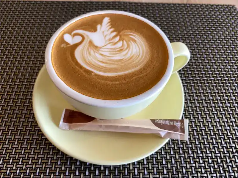 A coffee with a swan poured in the milk foam