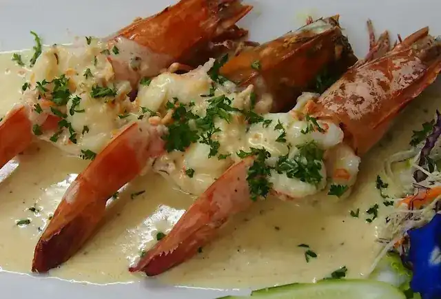 Prawns in a cream sauce with chopped parsley