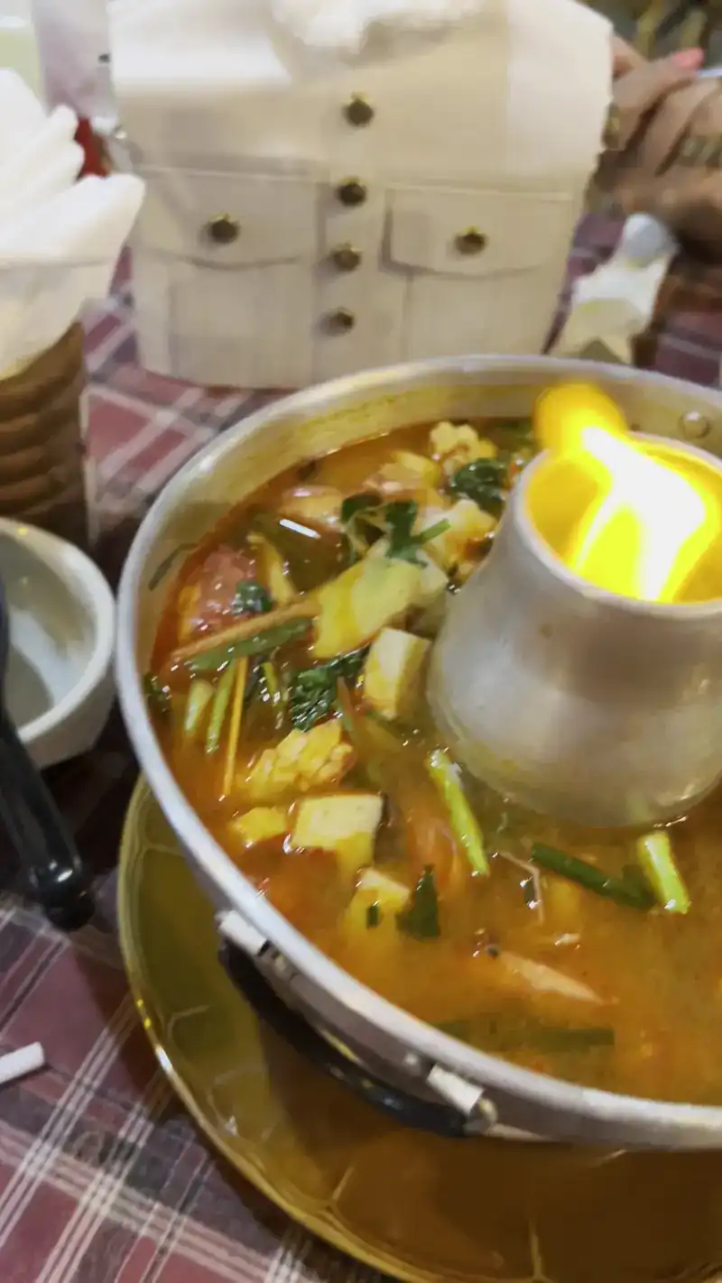 Soup served in a hotpot with a flame in the middle
