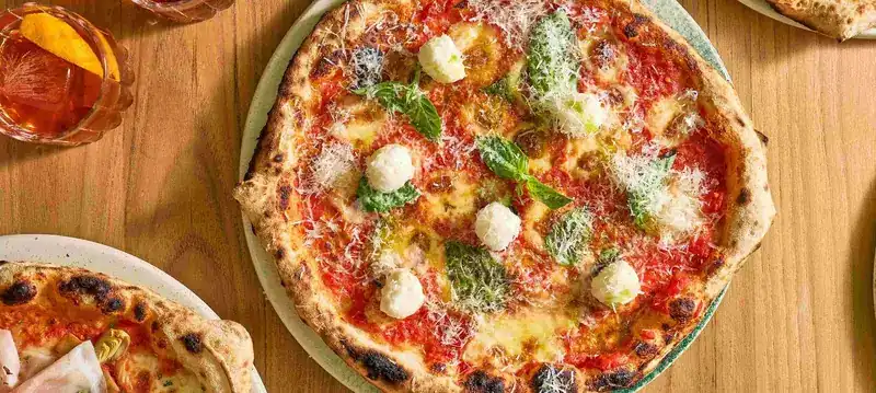 Pizza Margherita on a wooden table