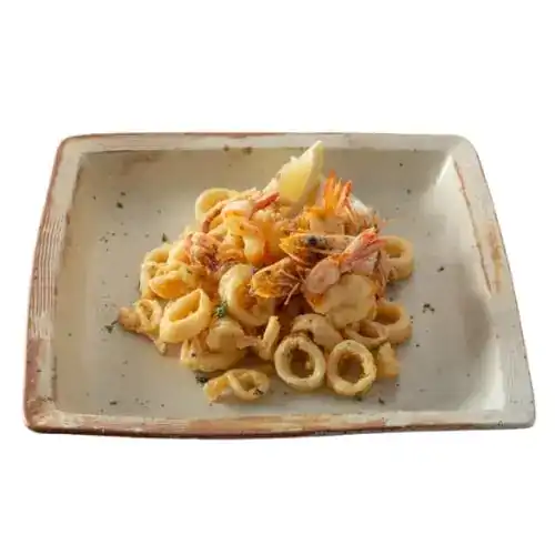 Plate of fried squid rings and prawns with lemon