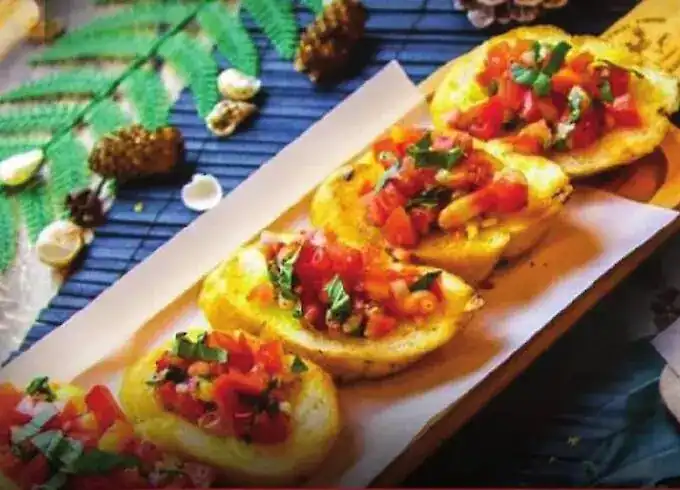 Tomato bruschetta on a wooden board