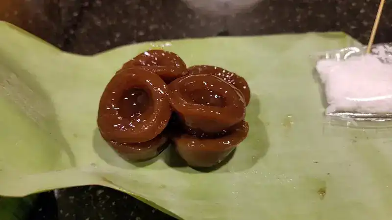 Brown khanom rings on banana leaf