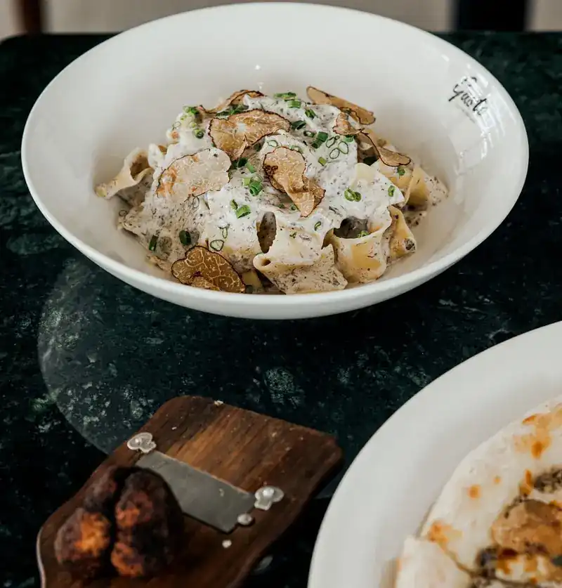 Ribbon pasta in a cream sauce with shaved truffle
