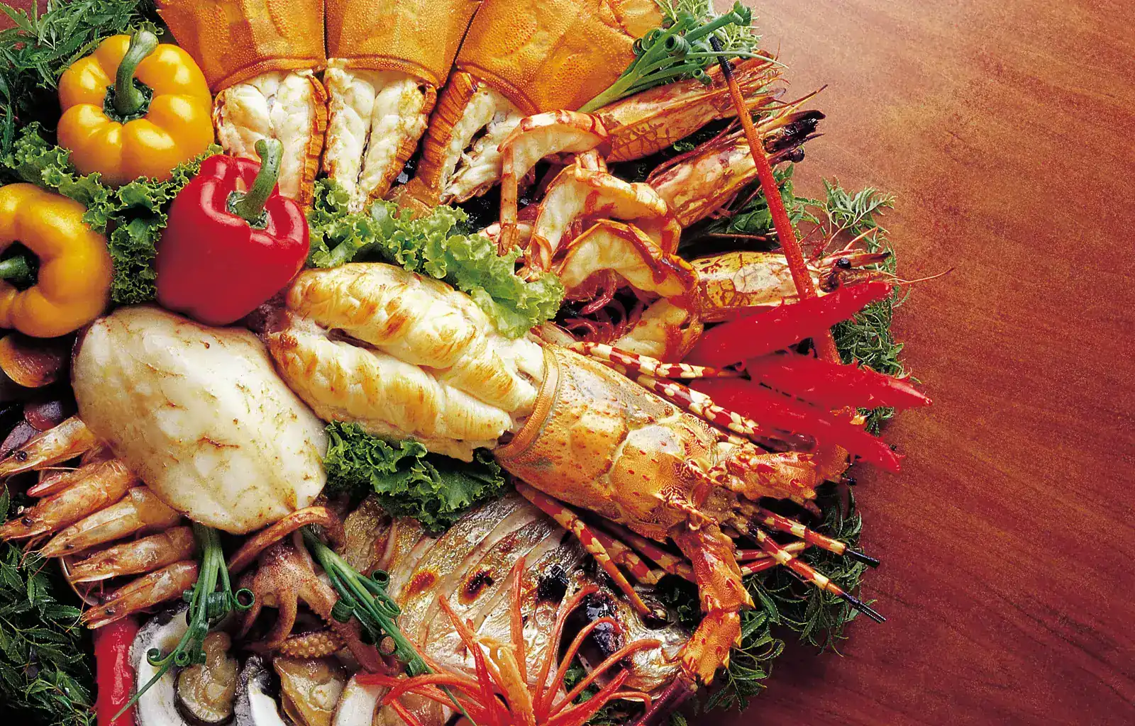 A platter of grilled Phuket lobster, tiger prawns, fish, squid and oysters