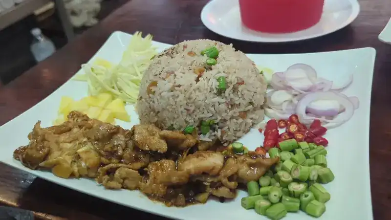 Rice with sweet pork, green mango, shallots, chillies and long beans
