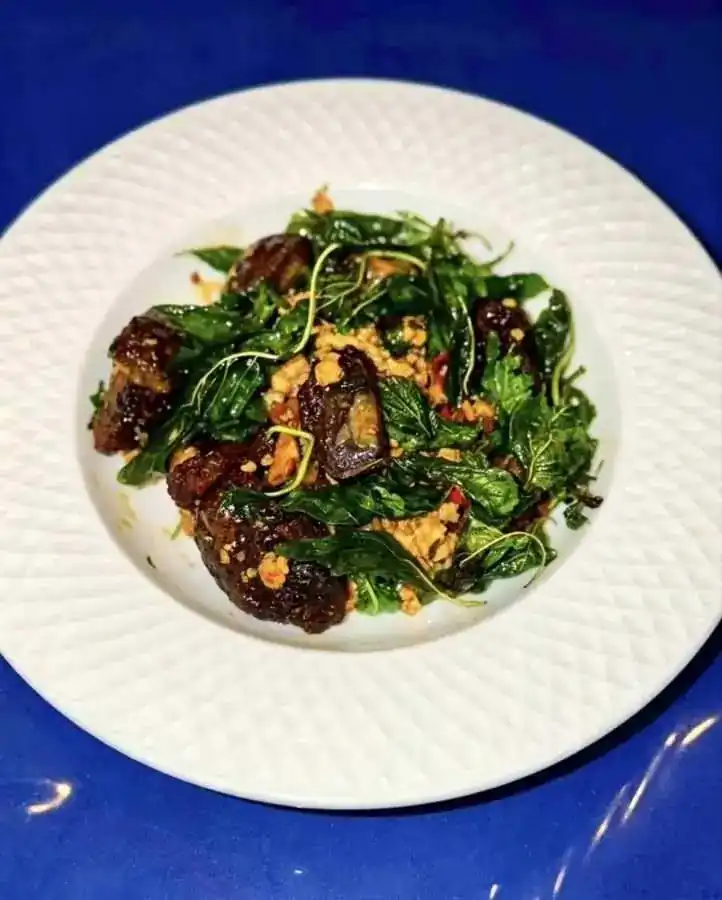 Chicken and century egg stir-fried with crispy holy basil