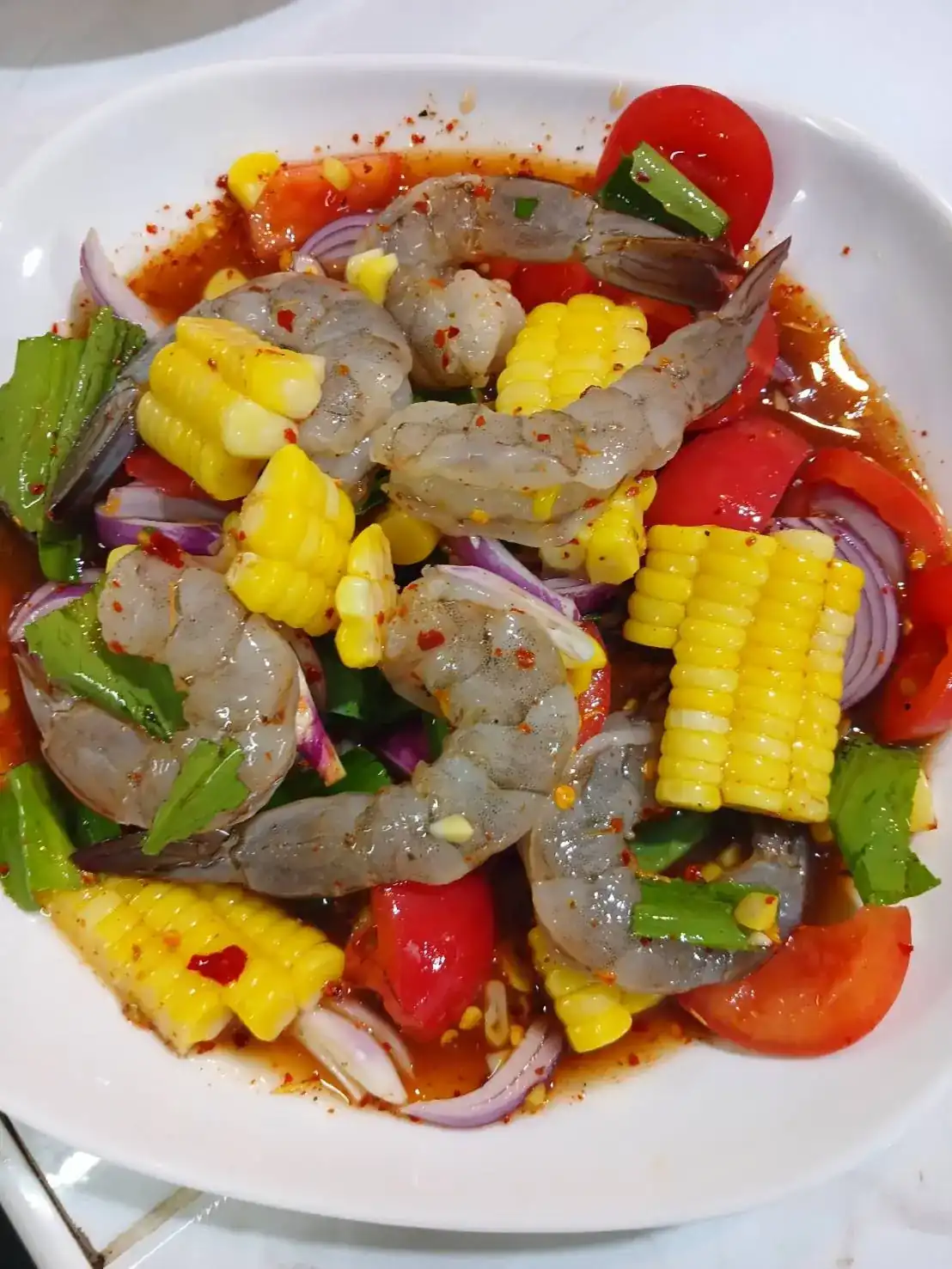Fresh shrimp tossed with sweet corn, tomato, red onion and a chilli dressing