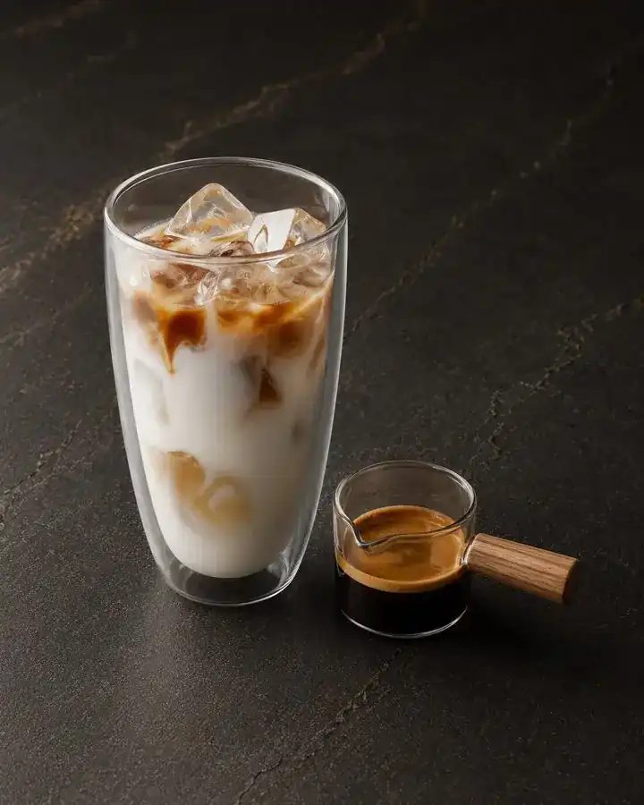 Iced latte with a shot of espresso on the side