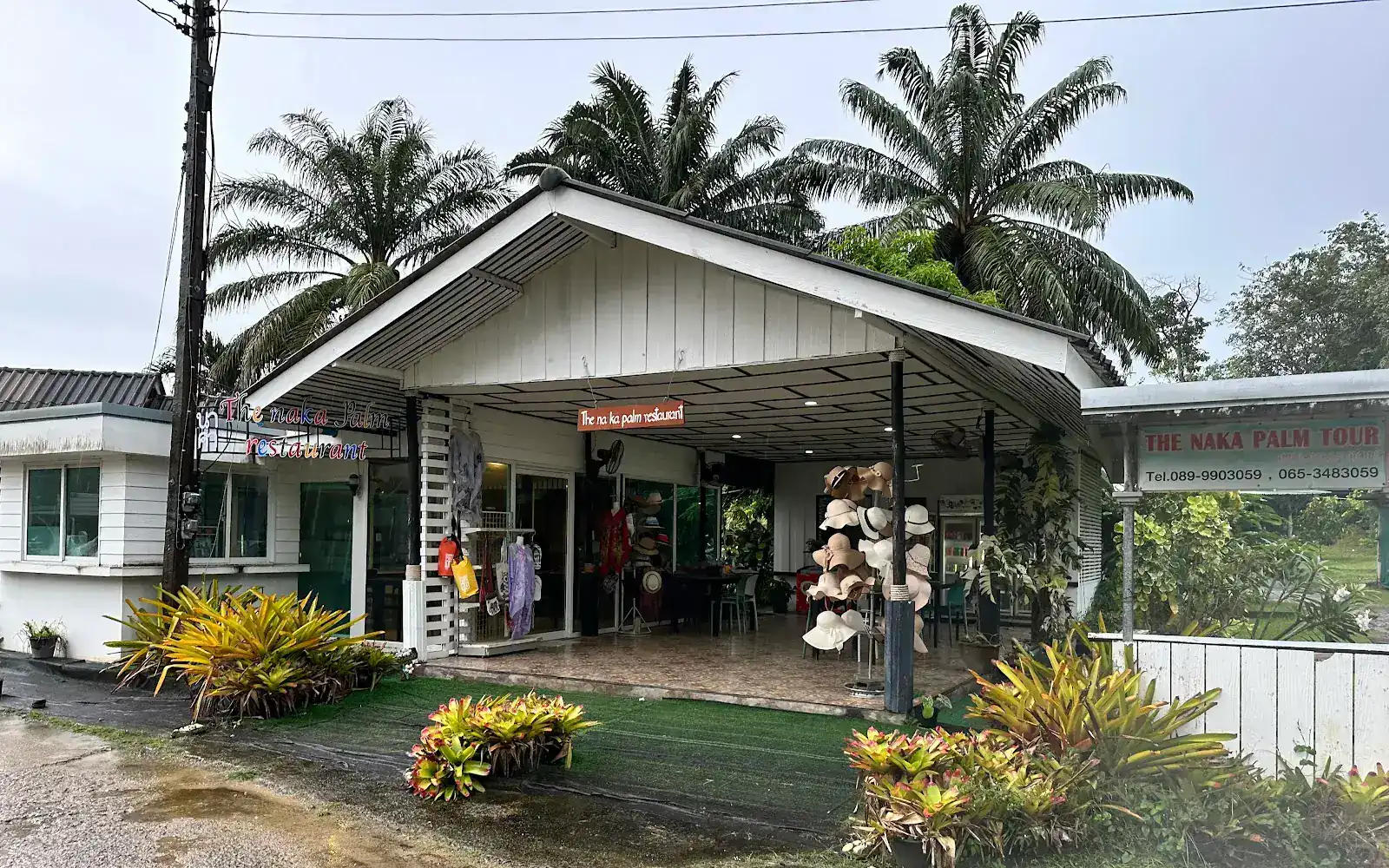 The Naka Palm Restaurant, a white open-fronted house under palm trees / ร้านเดอะนาคาปาล์ม บ้านสีขาวเปิดโล่งใต้ต้นปาล์ม