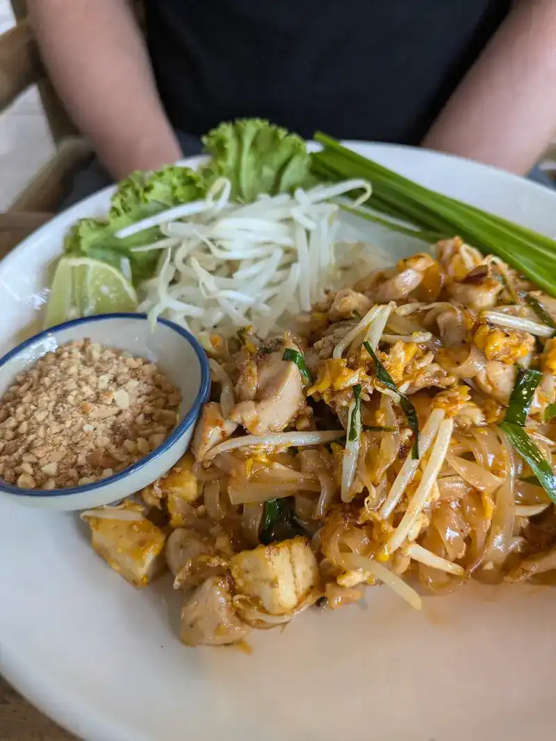 Pad thai with bean sprouts, chives, lime and crushed peanuts