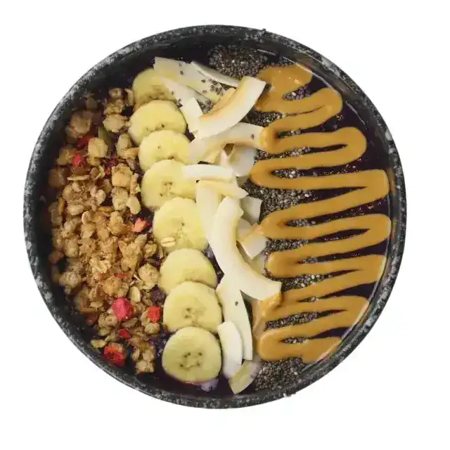Açaí bowl with banana, coconut, granola, chia and peanut butter