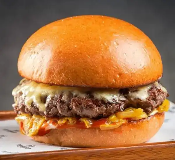 My Way Cheese Burger: a Wagyu beef patty under melted Cheddar, with mustard glazed onions, in a glossy bun