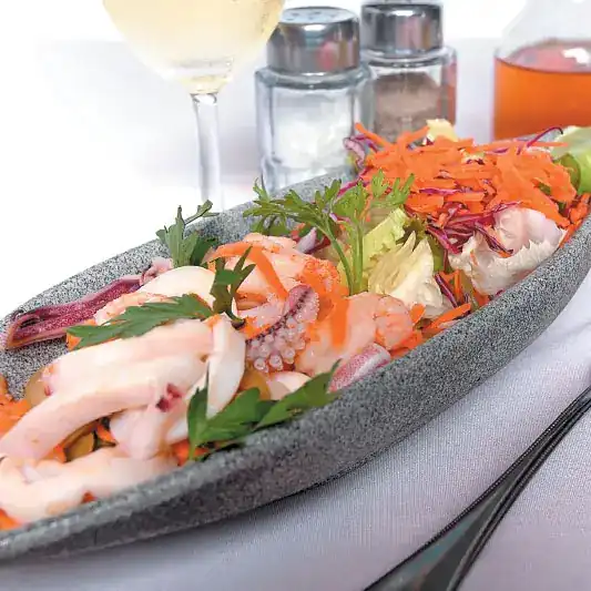 Italian seafood salad with squid and prawns