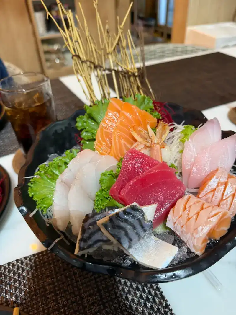 A sashimi platter of salmon, tuna, white fish and mackerel on ice