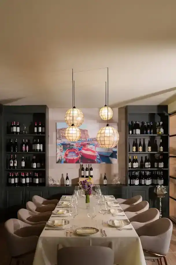 The private table under a painting of the harbour in Naples