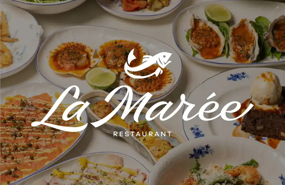 La Marée: scallops, oysters and carpaccio on blue-rimmed plates